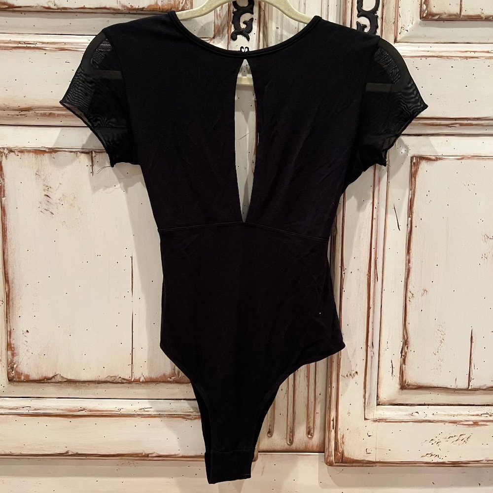 Joah Brown black short sleeve, open back bodysuit with front slit size M/L